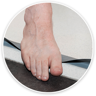 Foot on the rubber water barrier