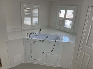 Walk in tub installed in the corner of the room